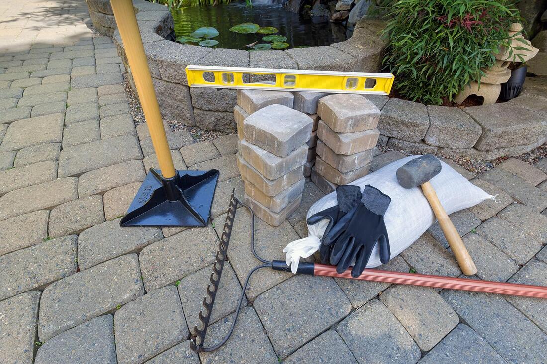 paving stone and tools